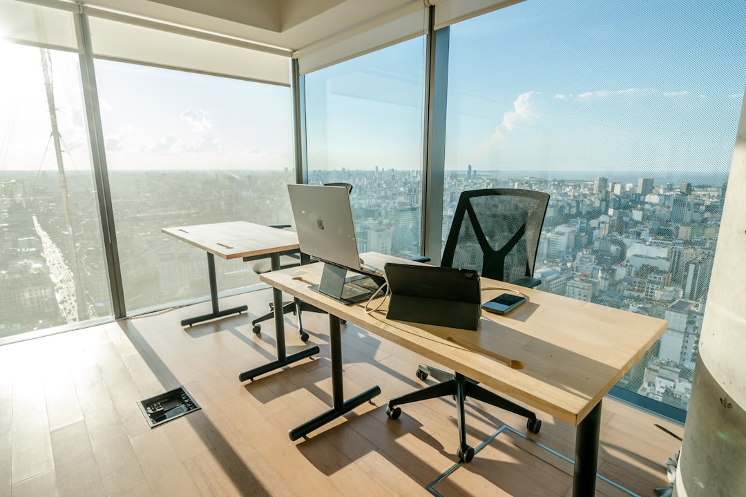 Professional office workspace displaying EV charger installation projects and modern electrical service equipment