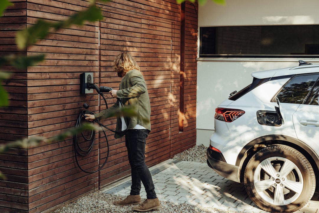 Professional electrician installing EV charging station