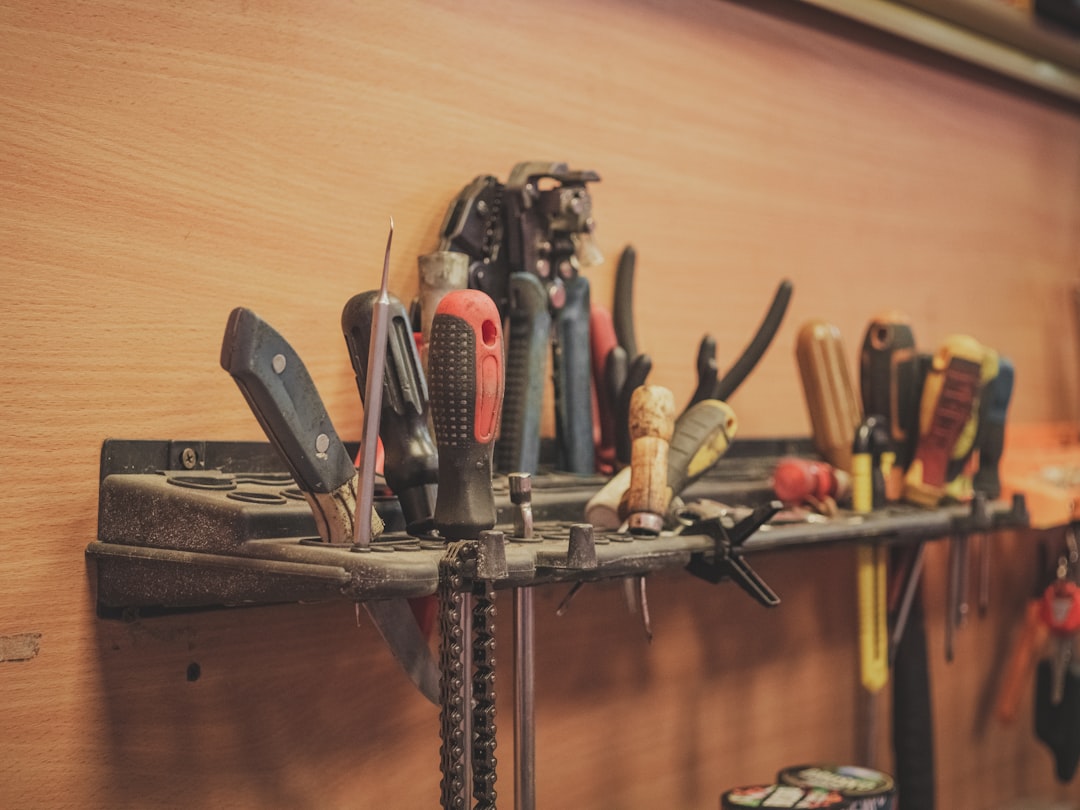 Professional electrician performing electrical installation work with modern tools and organized workspace